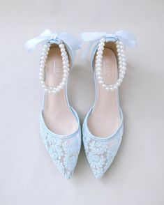 Classic crochet lace pointy toe with low heels with double pearls ankle strap. The luminous pearls makes this a classic and elegant heel for any bride. Perfect for brides, bridal party, bridesmaids, prom, parties, or any special occasion. DETAILS: HEELS: 2 inches COLORS AVAILABLE: Ivory, White, and Light Blue UPPER: Synthetic upper and lining MATERIALS: Manmade outsole ORIGIN: Imported Blue Heels With Pearls, Wedding Low Heels, Bride Shoes Low Heel, Low Heel Wedding Shoes, Shoes Editorial, Blue Bridal Shoes, Flower Girl Shoes, Bridal Flats, Bridal Shoes Flats