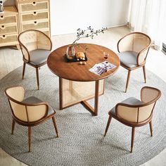 a round table with four chairs around it