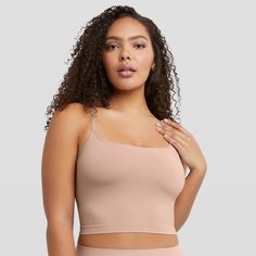 YOUR NEW CAMI GO-TO Fresh. Modern. Confident. You are going to love the versatility of this cami. The Seamless Smoothing Cropped Cami provides the extra boost you need with body-hugging styles. Seamless and lightweight, this women’s bodywear cami is crafted from a single-layer fabric for light smoothing. A built-in shelf bra offers support while the modern cropped length has a ribbed hem that lightly embraces your midsection. Perfect for layering, this versatile cropped cami features adjustable Fabric Construction, Crop Top Bra, Cropped Cami, Shelf Bra, Cami Tops, Shapewear, Wardrobe Essentials, Fabric Color, Gender Female