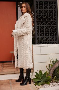 Like your coziest blanket, the Sasha Cream Floor Length Coat is like a warm hug of a cold day. Similar to the Vivienne Grey Snake Faux Fur Jacket but we heard your feedback and created the Sasha with a slightly smaller fit. With its all over plush material, notched lapel, and textured finish, this coat elevates even the most basic of outfits. It’s the perfect cherry on top of your favorite Fall look. Cozy Long Beige Coat, Cozy Long Cream Outerwear, Long Beige Cozy Outerwear, Beige Long Cozy Outerwear, Cozy Outerwear In Winter White With Soft Texture, Cozy Long Faux Fur Coat, Cozy Snug Winter Outerwear, Cozy Snug Outerwear For Winter, Cozy Snug Outerwear For Cold Weather