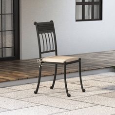 a chair sitting on top of a wooden floor next to a building