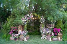 an outdoor ceremony with flowers and candles