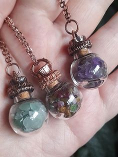 These glass vial orb pendants have been copper electroformed, darkened using patina and then sealed with a commercial grade metal protectant. They are also available in natural Copper without patina which will look more rose gold. All have been paired with a matching nickel free, anti-tarnish chain 60cm in length. Will update with any additional stone types as they become available but currently have the following material.  Green Adventurine Amethyst Mixed Tourmaline NB - Please note this item is thin blown glass and as such should be treated with care.  Each necklace comes with a 60cm, nickel free, matching chain. Necklace will be sent in a branded pouch and sent in a protective box.  ** If you would like multiples of these please send me a PM as I can make a batch of these to order. The Tiny Bottle Necklaces, Potion Bottles Aesthetic, Cool Bottles, Crochet With Wire, Elven Tree, Gifts For Witches, Stone Types, Vial Necklace, Alternative Gifts