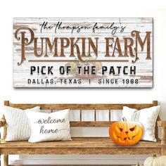 pumpkin farm pick of the patch sign with jack - o'- lantern on bench