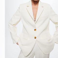 Selling This Gorgeous White Blazer - Bought It For My Wedding And Removed The Tags But It Was Warm Enough And I Did Not End Up Needing It. My Closet Doesn’t Have Any Use Of A White Blazer Otherwise I Would Keep It. Structured Design. Oversize Design. Long Design. Suit Style. Lapel-Collar V-Neck Collar. Long Sleeve. Shoulder Pad. Decorative Seams. Welt Pocket On The Chest. Two Pockets With Flaps On The Front. Inner Lining. Button Fastening On The Front Section. Co-Ord. Blazer Style. Fits Bigger T White Wedding Outerwear With Button Closure, White Wedding Blazer With Buttons, White Fall Wedding Suits, Spring Wedding Blazer With Hidden Button Closure, Spring Wedding Blazer With Button Closure, Fall Wedding Suits With Button Closure, Single Breasted Blazer For Wedding, Cream Blazer For Fall Wedding, White Wedding Blazer With Hidden Button Closure