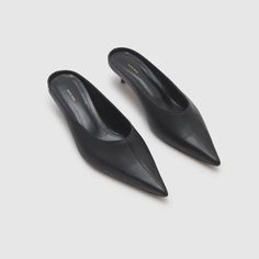 A Versatile Pair Of Slip-On Mules Made From Smooth 100% Cow Leather Featuring A Pointed Toe, Square Back Sole, And Understated Kitten Heel. The Rooney Mules Come Accented With A Gold-Tone Anine Bing Monogram At The Outer Portion Of Both Heels, Serving As A Discrete Touch Of Signature Branding. Take Your True Size. If You Are Between Sizes, We Recommend Taking The Next Size Up. Brand New, Never Been Worn, In Box. Size 38 Heel Height: 1.9” Gold Slides, Slip On Mules, Anine Bing, Black Slip Ons, Kitten Heel, Mule Clogs, Mules Shoes, Wearing Black, Cow Leather