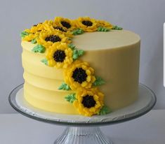 there is a cake with sunflowers on it