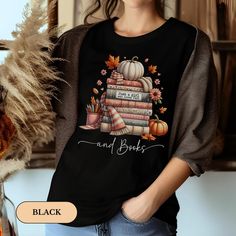 Welcome to WittyCreationsGifts! ABOUT OUR Just a Girl Who Love Fall T-shirt - Bella Canvas Wrap yourself in the warm embrace of autumn with this shirt that celebrates your love for books and the coziest season of the year. Perfect for rainy day reading by the window, this garment is a tribute to the magic of fall and literature.  👉 Unisex T-shirt - 100% Airlume combed and ring spun cotton - Soft cotton and quality print make users fall in love with it over and over again. - These t-shirts have- Fall Bookish Tops With Graphic Print, Fall Graphic Print Bookish Tops, Bookish Crew Neck Top With Character Print, Cute Black Top With Sublimation Print, Bookish Halloween Graphic Print Top, Bookish Graphic Print Top For Halloween, Black Bookish Tops With Text Print, Black Bookish Top With Letter Print, Black Bookish Top With Text Print