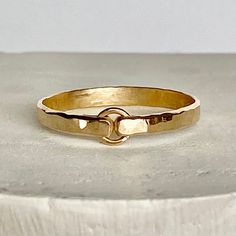 This is modeled after the tiny circle band, but made with a much heavier gauge wire. I forge and hammer the metal to a 4 mm gold filled circle. The last three pictures show the difference in width between the dainty and thicker bands. Choose from sizes 4-10. Try stacking these with the other rings. View the rest of the ring collection below: http://www.etsy.com/shop/BellatrinaJewelry?section_id=11006644 ** Follow us for updates, contests, and promos. :) www.facebook.com/BellatrinaJewels www.twit Stacking Rings Wedding, Thick Gold Band, Gold Circle Ring, Initial Bracelet Gold, Gold Band Wedding Ring, Hammered Gold Ring, Mixed Metal Rings, Stackable Rings Wedding, Stacked Wedding Rings