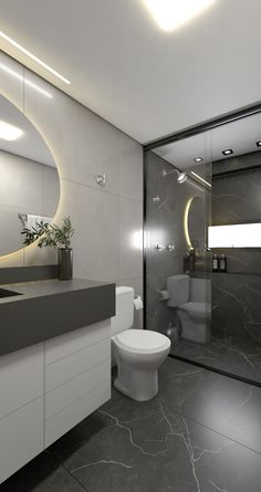 a bathroom with a toilet, sink and mirror in it's center wall area