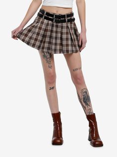 Bring a little bit of that grunge vibe to your pleated skirt rotation with this low-rise style in a brown and beige colorway. It comes with a removable double-strap  faux leather belt.65% polyester; 35% rayonWash cold; dry flatLength: 15"ImportedListed in junior sizesModel is 5'10"Model wear size Small Punk Pleated Mini Skirt For Fall, Trendy Brown Mini Skirt For Fall, Trendy Brown Fall Mini Skirt, Fitted Brown Mini Skirt With Belt Loops, Trendy Pleated Brown Bottoms, Fall Brown Pleated Mini Skirt, Edgy Fall Pleated Mini Skirt, Brown Grunge Bottoms For Fall, Brown Mini Skirt With Belt Loops