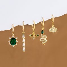 "Huggie Hoop Gift Set, Nature Inspired Earring Stack, Sets for Multiple Piercings, Everyday CZ Stacking Colorful Emerald Snake, Cloud, Bee ✨These earrings feature a charm of your choice hanging from a dainty 18k Gold Plated huggie hoop. These hoops are sold as SINGLES, or as PAIRS - both options are available to select from the 2nd drop down menu. Mix & match these earrings to create fun and unique pairs!  H O W ∙ T O ∙ O R D E R 1st DROP DOWN menu * Select the CHARM OPTION you would like for your hoop(s) - see listing photos for all options 1st DROP DOWN menu * Select if you would like a SINGLE EARRING or a PAIR OF EARRINGS C H A R M ∙ O P T I O N S  * Art Deco Bar * Bumblebee * Cloud * Oval Emerald Quartz * Snake **ALL Charm Options available to purchase - you can select the SINGLES (1 o Simple Bridesmaid Jewelry, Hoops With Charms, Earring Stack, Art Deco Bar, Multiple Piercings, Bridal Earrings Drop, Bridesmaid Gifts Jewelry, Personalized Gift Wrap, Jewelry Lookbook