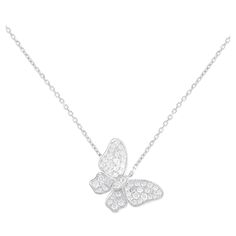 This necklace possesses an undeniable charm. Crafted entirely from 18K White Gold, it features a butterfly pendant measuring 0.75 long suspended from a 15.5 chain. Sparkling Diamonds with a total weight of 0.65 carats provide the perfect finishing touch.This jewelry piece is offered in brand new condition and includes a gift box.