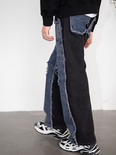 The Raw Edge Deconstructed Pants offer a bold and innovative twist on traditional denim. These pants seamlessly blend the relaxed comfort of black sweatpants with the rugged appeal of washed blue denim, achieved through a daring front splicing. The areas where the fabrics meet are heavily frayed, adding an element of raw edginess. The design is further enhanced by deliberate rips at both knees and the clever use of blue denim patches for the back pockets, creating a unique, avant-garde look. Cra Deconstructed Pants, Black Sweatpants, Denim Patches, Premium Denim, Denim Pant, Denim Fabric, Raw Edge, Blue Denim, Sweatpants