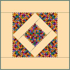 a square quilt with different colored squares on it