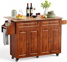 a kitchen island with two wine glasses on it and other items sitting on the top