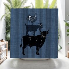 a blue shower curtain with an image of two animals on top of each other and a rooster