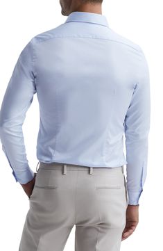 A French placket and cutaway collar emphasize the smart, simple detailing of a shirt tailored from cotton twill and styled to complement any semiformal look. 30" length; 39" chest (size Medium) Cutaway collar Long sleeves with one-button cuffs 100% cotton Machine wash, line dry Made in Turkey Classic Fitted Shirt With Back Button Closure, Formal Slim Fit Top With Concealed Placket, Formal Fitted Shirt With Back Button Closure, Classic Fitted Tops With Welt Pockets, Formal Tops With Concealed Placket And Slim Fit, Tailored Blue Cotton Shirt, Classic Business Tops With Welt Pockets, Classic Formal Tops With Welt Pockets, Tailored Cotton Top For Formal Occasions