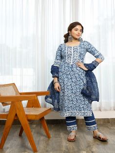 Affordably stylish every day clothing. This handmade indigo bagru print A cotton a-line kurti with gota detailing is tastefully decorated with flower designs. includes a lace-trimmed pant and a chanderi indigo-printed dupatta with paisley borders on the ends. You must have ethnic clothing in your collection this season. Neck: Round Neck Sleeve Length: 3/4th Sleeves Kurta Length: Calf Length Fabric: Kurta & Bottom - Cotton Dupatta - Chanderi Note: Wash Care Instructions - Dry Clean Only. The prod Cotton Anarkali Set With Floral Print For Diwali, Cotton Floral Print Dupatta For Diwali, Diwali Cotton Anarkali Set With Floral Print, Unstitched Floral Cotton Anarkali Set, Unstitched Cotton Anarkali Set With Floral Print, Bohemian Indigo Straight Kurta Set, Cotton Salwar Kameez With Floral Print For Navratri, Floral Print Cotton Salwar Kameez For Navratri, Anarkali Cotton Salwar Kameez With Floral Print