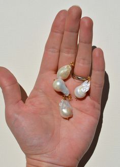 Baroque pearl drop earrings 14K gold filled, natural baroque pearls SIZE NOTES 15mm to 20mm long SUSTAINABLY MADE From Gem & Blue (Denver Colorado) Sustainable Values: #5: Safe, livable, dignified employment SUSTAINABLE CARE Gold filled jewelry will not tarnish, but may become dirty over time. To clean, use mild dish soap, hot water, and a gentle cloth. Baroque Pearl Drop Earrings With Pearl Pendant, High Luster Baroque Pearl Drop Jewelry, High Luster Drop Baroque Pearl Jewelry, Briolette Pearl Earrings For Gift, Briolette Pearl Earrings With Pearl Charm As Gift, Briolette High Luster Pearl Earrings For Gift, Briolette High Luster Pearl Earrings As Gift, High Luster Briolette Pearl Earrings For Gift, High Luster Briolette Pearl Earrings As Gift