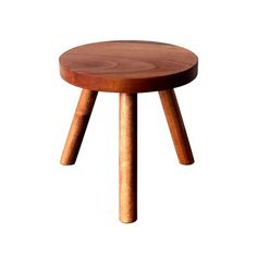 a small wooden stool sitting on top of a white floor