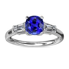 METAL SPECIFICATIONS White Gold 14K STONE SPECIFICATIONS Stone Name : Blue Sapphire and Diamond Stone Cut : Cushion and Baguette Stone Details : There is one cushion cut sapphire approx. 2 carats (Approx. Size 6.5 x 6.5 mm) and two baguette diamonds approx. 0.12 carats each (Approx. Size 3 x 2 mm) on the sides. Natural earth mined stones. Color : G Clarity : VVS1 Quality of Sapphire : AAA Sapphire Treatment : Heated Total : Approx 2.25 Carats RING SPECIFICATIONS Size : 6.5 (Can ship in any size, Ceylon Sapphire Ring, Ceylon Sapphire, Baguette Diamonds, Sapphire Diamond Ring, Gadget Gifts, Natural Earth, Stone Cuts, Baguette Diamond, 2 Carat