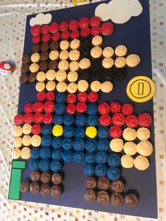 a cake made to look like an american flag with cupcakes in the shape of a man