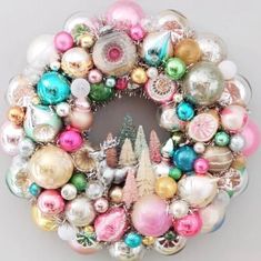 a christmas ornament wreath with ornaments around it