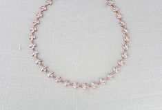 This delicate rose gold bridal necklace is set with marquise cubic zirconia and was made to make your wedding day shine a little brighter! - Crafted with Swarovski Pure Brilliance cubic zirconia stones - Necklace measures 16 inches and extends to 18 inches with an extension chain. (extension chain not pictured in photos) - Available in rose gold, yellow gold and rhodium finish - Nickel free and hypoallergenic - PLEASE ALLOW APPROX 5 BUSINESS DAYS FOR COMPLETION BEFORE SHIPPING ** if you would li Rose Gold Cubic Zirconia Diamond Necklace For Wedding, Delicate Rose Gold Cubic Zirconia Bridal Necklace, Delicate Rose Gold Diamond Necklace For Wedding, Delicate Marquise Necklace For Wedding, Delicate Marquise Wedding Necklaces, Gold Bridal Jewelry, Rose Gold Bridal Jewelry, Dainty Wedding, Gold Bridal Necklace