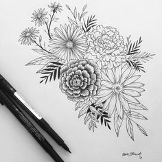 an image of flowers drawn on paper with two markers and pencils next to it