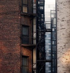 a fire escape on the side of a brick building