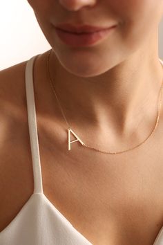 "Big letter necklaces are perfect for all outfits. It is so dainty, elegant and chic. Here you will find the super elegant initial necklace with us. You may design your alphabet necklace with any large letter you want. This sideways necklace will be a great silver gift idea for any women or mom. Big Letter form becoming really original and stylish. So you will have one of the most stylish gift in the world.  The gold name necklace is a durable solid necklace. First quality materials are used while producing our letter necklaces.  Our chains are produced by hand with a special system. It has a solid form. All our jewelry is %100 custom made by hand with Love and Care in our workshop! Nickel Free High Quality Materials Standard Deliver in 8-20 Business Days Name size - lowercase letters are Simple Initial Pendant Necklace With Clavicle Chain, Simple Initial Necklace With Clavicle Chain, Minimalist Monogram Letter Necklace, Elegant Everyday Letter Necklace, Minimalist Monogram Necklace, Minimalist Initial Necklace With Custom Name, Name Chain Gold, Name Chain, Gift Letter