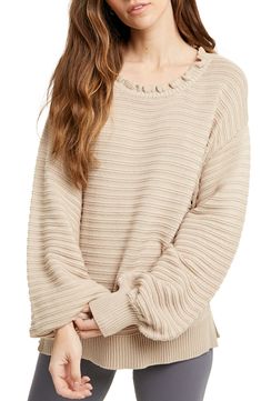 Bountiful balloon sleeves frames this darling ribbed knit sweater topped with a sweet ruffled neckline for an adorably cozy look. Jewel neck Long sleeves with ribbed cuffs 55% acrylic, 45% cotton Machine wash, dry flat Imported Model stats: 5'10", 32" bust, 25" waist, 36" hip. Model is wearing size Small. Casual Cream Sweater With Ruffles, Ruffled Long Sleeve Knit Sweater, Casual Knit Sweater With Ruffles, Casual Ribbed Sweater With Balloon Sleeves, Trendy Knit Sweater With Ruffles, Ruffled Crew Neck Knit Sweater, Crew Neck Knit Sweater With Ruffles, Knit Ruffle Crew Neck Sweater, Knit Crew Neck Sweater With Ruffles