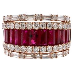 This is an exquisite ruby and diamond band that will go with any outfits. It's the perfect smart casual band with the channel set ruby baguettes in the the middle with round and baguette diamonds on the shoulders. Size: 6.25 (can be resize) Ruby: 1.27 cts, Baguette Diamonds: 0.45 cts, Round Brilliant / Baguette Metal: 18k Rose Gold Luxury Pink Baguette Cut Ruby Ring, Luxury Ruby Ring With Diamond Baguette Cut, Luxury Diamond Ruby Ring With Baguette Cut, Luxury Lab-created Ruby Ring, Luxury Red Baguette Diamond Jewelry, Red Ruby Ring With Baguette Diamonds, Luxury Red Ruby Ring Baguette Cut, Elegant Ruby Ring With Baguette Diamonds For Formal Occasions, Elegant Ruby Ring With Baguette Diamonds For Formal Events