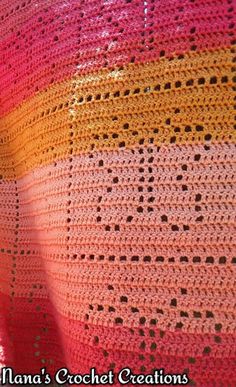 there is a crocheted blanket that looks like it has been made with yarn