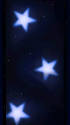 three white stars in the night sky