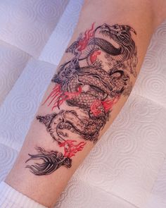 a person with a dragon tattoo on their arm