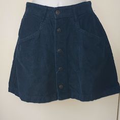 New Free People Cord Mini. Beautiful Ebony Deep Blue Color, Perfect For Fall. Button Down Front And Side Pockets. Never Worn, Tag Came Off When Opened Blue Mini Skirt With Button Zip Fly, Blue Button-up Cotton Skirt, Casual Blue Skirt With Button Zip Fly, Blue Button-up Casual Skirt, Casual Blue Mini Skirt With Button Closure, Casual Blue Skirt With Button Closure, Blue Short Skirt With Button Closure, Trendy Blue Buttoned Skirt, Deep Blue Color