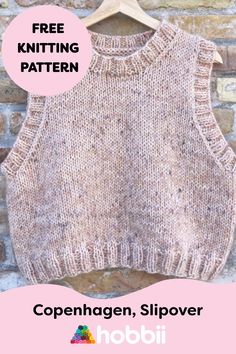 a knitted sweater hanging on a brick wall with the words free knitting pattern written below it