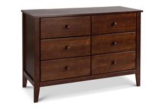 a brown wooden dresser with six drawers