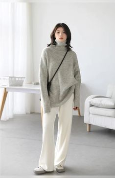 The Oversized Turtleneck Solid Loose Sweater is the epitome of cozy-chic fashion. With its relaxed, roomy fit and high turtleneck collar, it offers both comfort and style in one versatile package. Crafted in a single, solid color, it's a minimalist's dream, easily paired with a variety of outfits. Whether you are lounging at home or stepping out on a crisp day, this sweater keeps you warm, fashionable, and effortlessly comfortable. Relaxed Fit Turtleneck For Winter, Casual Oversized Turtleneck Outerwear, Oversized Turtleneck Outerwear Casual, Trendy Oversized High Neck Turtleneck, Trendy Oversized Turtleneck With High Neck, Trendy Oversized Knit Turtleneck, Casual Long Sleeve Chunky Knit Turtleneck, Casual Solid Chunky Knit Turtleneck, Casual Chunky Knit Long Sleeve Turtleneck