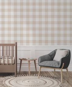 a baby's room with a crib, rocking chair and small table on the floor