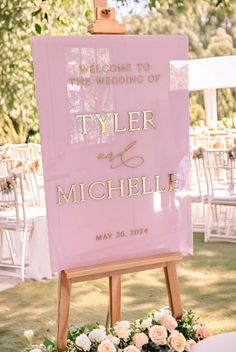 a sign that says welcome to the wedding of tyler and michele