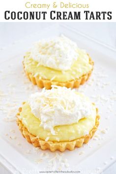 two coconut cream tarts sitting on top of a white plate