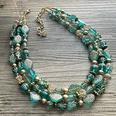 💞Two of a kind & ready to ship💞  A fun mix of turquoise green - blue beads & acrylic ball beads. Punctuated with gorgeous gold.  Approximately 16 inches long with a plated toggle closure and 4 inch extension chain.  *Smoke and pet free home!* I ship 6 days a week! Thank you for browsing my store! Turquoise Multi-strand Necklace For Party, Vintage Multi-strand Turquoise Jewelry, Turquoise Necklace With Large Beads For Party, Turquoise Spacer Beads Jewelry For Party, Geometric Light, Geometric Lighting, Vert Turquoise, Blue Winter, Beaded Statement Necklace