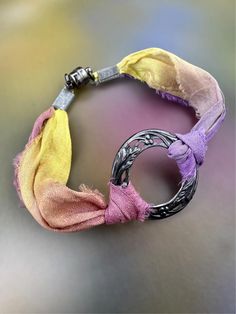 a close up of a bracelet on a table