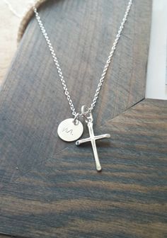 "« Cross Necklace with Initial // Personalized Sterling Silver Initial Charm // Hand Stamped Necklace // Baptism, Communion, Confirmation Gift » This listing is for a sterling silver cross necklace with a personalized initial disc charm. This makes a beautiful gift for so many occasions - baptism, confirmation gift, first communion, or birthdays. Simple enough to wear everyday, and matches perfectly with any outfit :) The cross charm and 9mm initial disc are strung from a fine 18\" sterling silv Personalized Cross Pendant Necklace For Baptism, Personalized Cross Necklaces For Baptism, Personalized Cross Necklace For Baptism, Personalized Baptism Cross Necklace, Christian Baptism, Silver Initial Charms, Silver Cross Necklace, Diamond Initial Necklace, Sterling Silver Cross Necklace