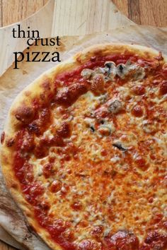 a pizza sitting on top of a wooden cutting board