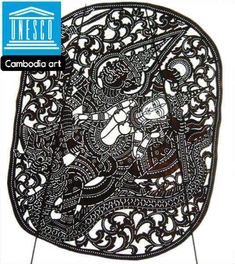 an intricately designed metal plate with the words cambodia art on it's side