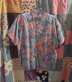 Adorable 80s - early 90s floral button up shirt with short sleeves. The flowers look a bit like watercolor painting and are in pink, purple, green and blue. The tag has been cut out so I'm not sure of the fabric content, but seems like possibly cotton to me. Is in used condition with general wear, but overall looks good and is ready to wear. No size marked -- see measurements to ensure fit. Measures are in inches and are taken of the item laid flat and not doubled. Shoulders: 17 Across armpits: Affordable Spring Button-up Shirt, Cheap Artistic Short Sleeve Shirt, Cheap Artsy Short Sleeve Shirt, Affordable 90s Style Short Sleeve Shirt, Cheap Floral Print Button-up Shirt, Cheap 90s Style Button-up Shirt, Cheap 90s Style Short Sleeve Shirt, Pastel Button Up, Floral Button Up Shirt Outfit